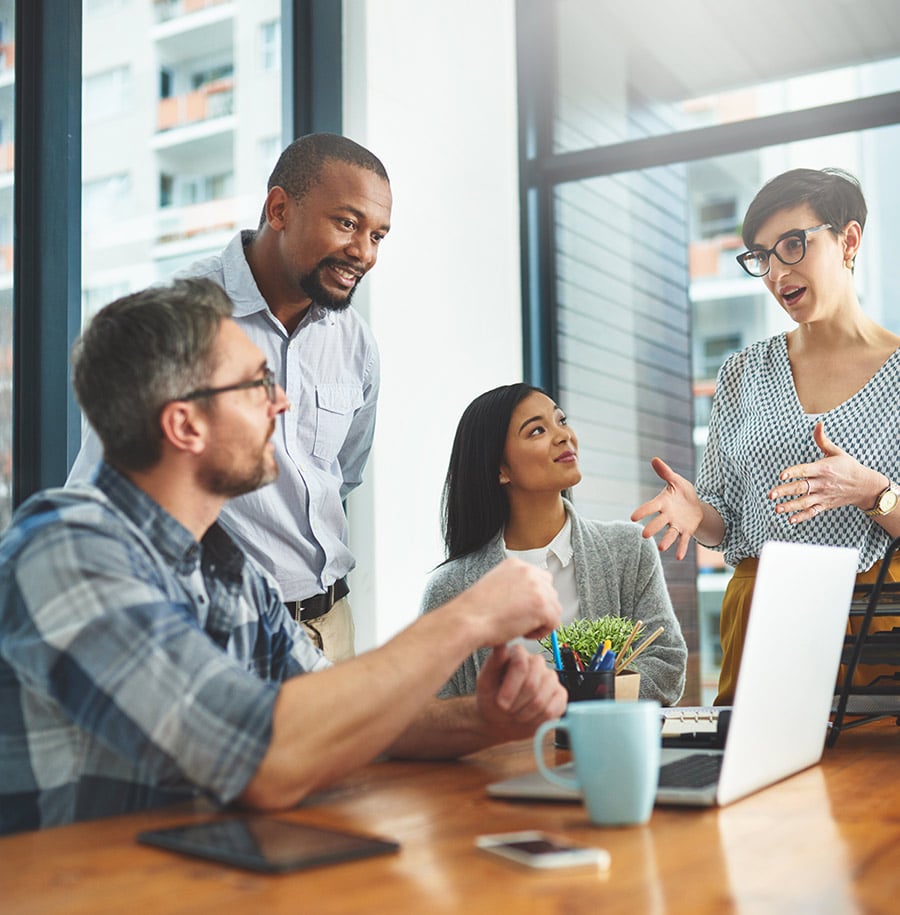 employee meeting over desk