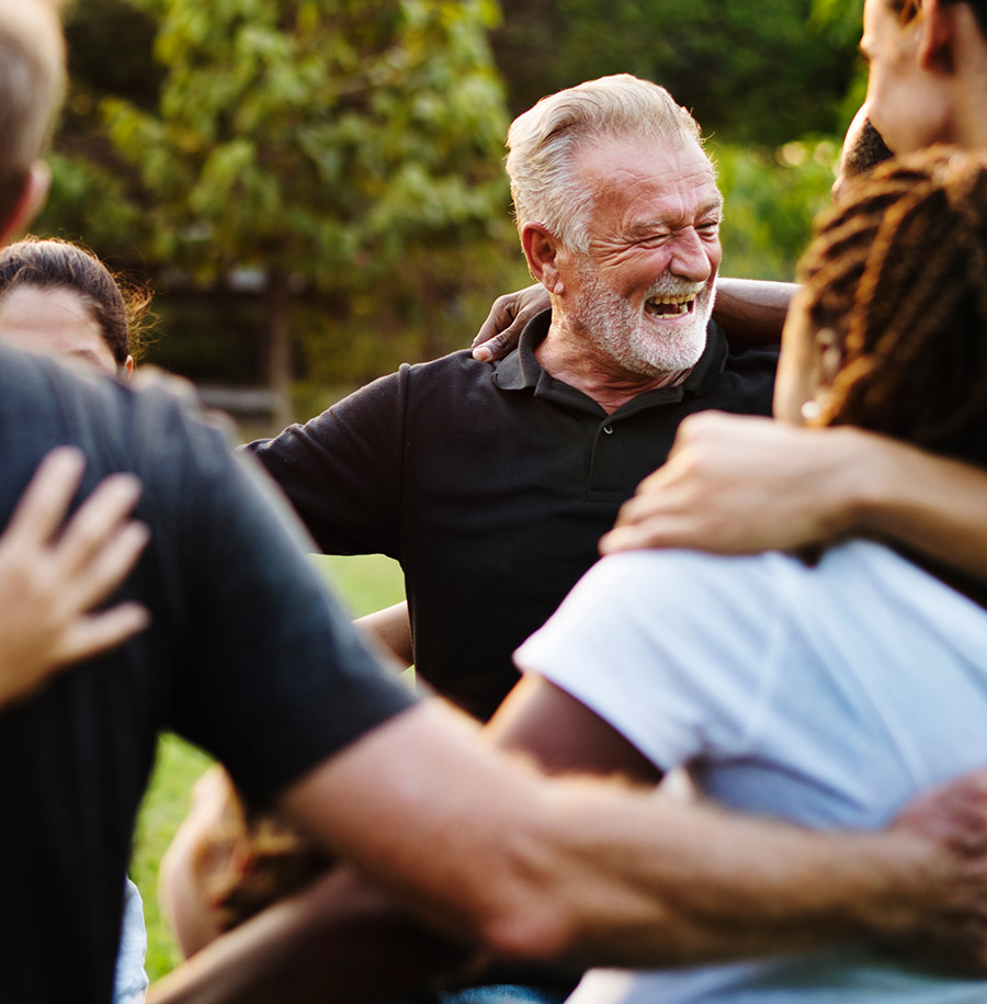 group of community members hugging