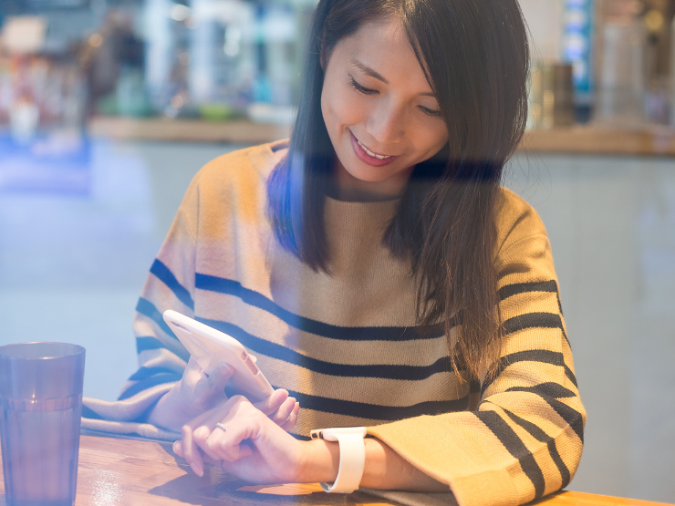 woman using smartwatch